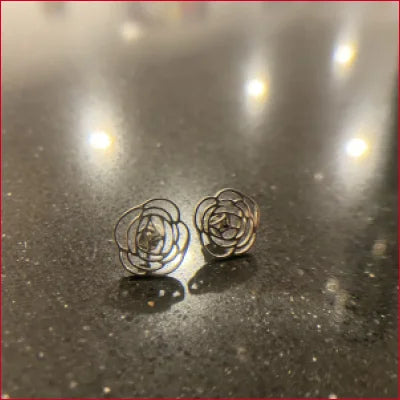 Pair of silver spiral-shaped stainless steel stud earrings for a unique style