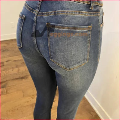 Pair of blue jeans displayed on a person showcasing Stained Women’s Pencil style