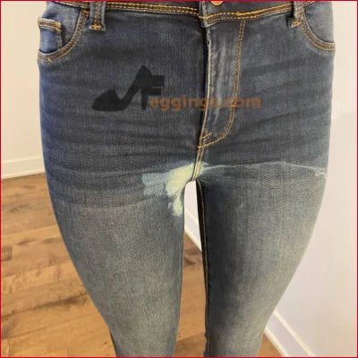 Pair of blue jeans with faded areas and stitching from Stained Women’s Pencil collection