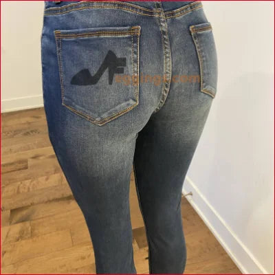 Pair of blue jeans with logo on back pocket for Stained Women’s Pencil style