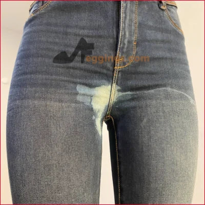 Pair of blue jeans with a wet spot highlighting unique stained women’s pencil design