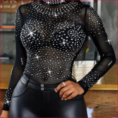 Sparkly black long-sleeved bodysuit with starry pattern for leather leggings look