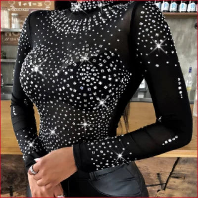 Sparkly black long sleeves bodysuit with rhinestones, perfect for leather leggings look