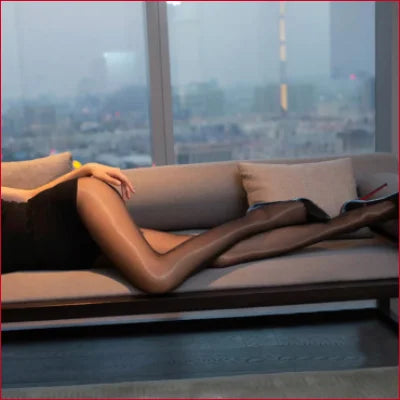 Person relaxing with Sheer Pantyhose Set beside a window, perfect for wedding dress lingerie