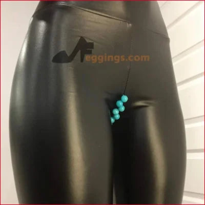 Black shiny leggings with turquoise jewelry beads and logo in stylish faux leather