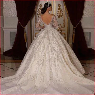 Ornate white sexy wedding dress with voluminous skirt and intricate lace detailing