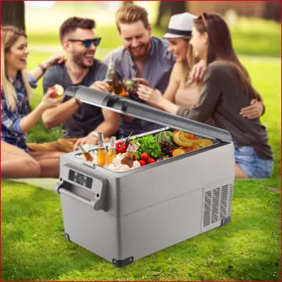 VEVOR Portable Refrigerator with ice, drinks, and produce in a dual-zone car refrigerator