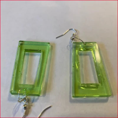 Pair of lime green rectangular dangle earrings in retro vintage style resin design