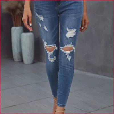 Distressed dark blue figure-sculpting denim jeans with ripped knees for a stylish look