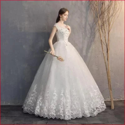 Elegant vintage off white bridal dress gown with lace details and full ball gown skirt