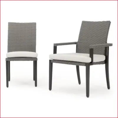 Two gray wicker chairs from the Vistano Weathered Gray Wicker Patio Dining Set