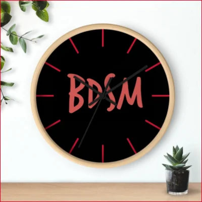 Unique high quality wall clock featuring BDSM in pink on a black face with red markers