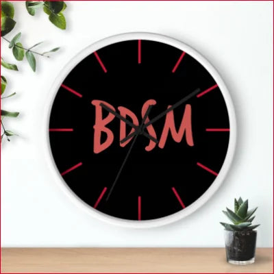 Unique high quality wall clock featuring BDSM in red on a stylish black face