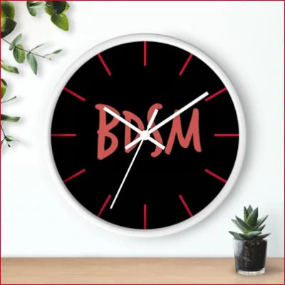 Unique high quality wall clock with BDM in pink on a black face for stylish decor