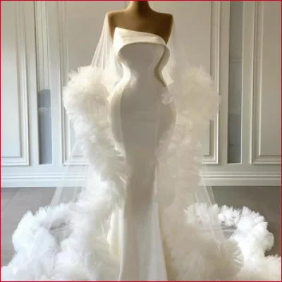 Elegant Mermaid Strapless Wedding Dress Bridal Gown featuring dramatic feathered accents