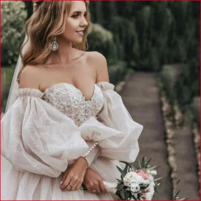 Detachable puffy sleeves wedding dress featuring off-shoulder puffed sleeves and sweetheart neckline