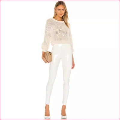 Woman in all-white outfit showcasing White Disco Pants Faux Leather Leggings