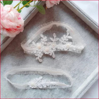 Delicate double white lace garters with floral embroidery for bridal wedding accessory