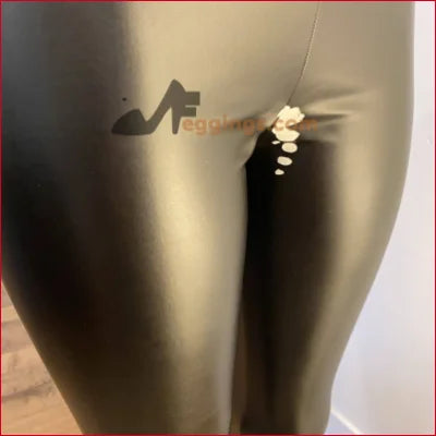 Handmade White Stained Black Vegan Leather Leggings on a mannequin with high-heeled silhouette