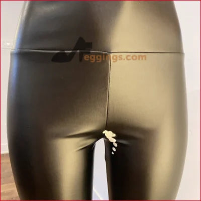 Shiny black vegan leather leggings with eggings.com logo for fetish fashion style