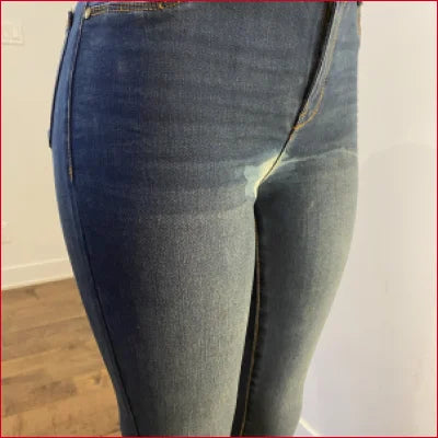 Chlorine stained men’s blue jeans showcasing a stylish tight fit on the lower body