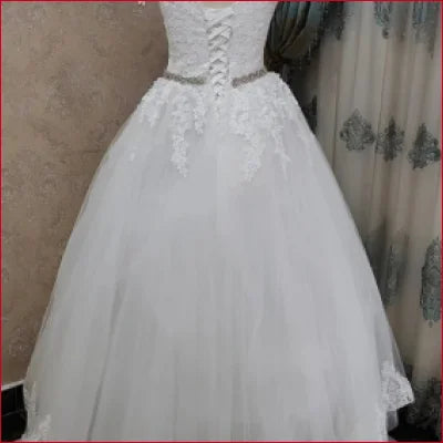 Elegant Off Shoulder Princess Wedding Dress featuring a corset bodice and tulle skirt