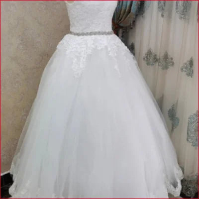 Off Shoulder Princess Wedding Dress features a voluminous white tulle skirt