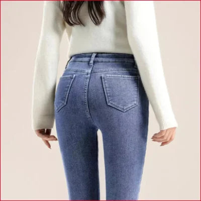 Cozy Slim Fit Fleece Velvet Lined Women’s Jeans in blue worn with a white top