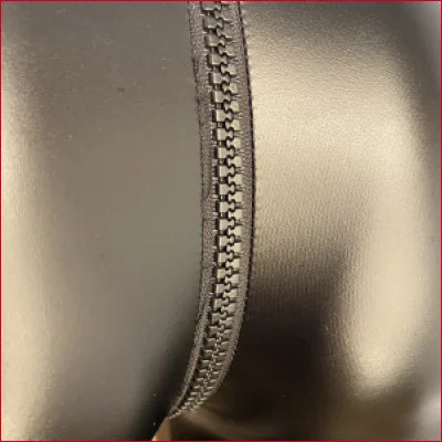 Zipper detail on Black Leather Crotch Zipper Leggings for a stylish look