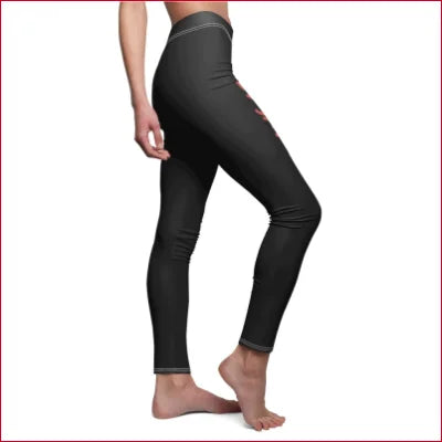 Black high-waisted elastic skinny fit leggings worn by a model showcasing style