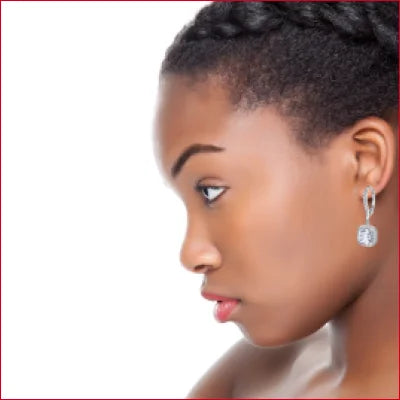 Profile view of a person wearing sterling silver zircon drop hoop earrings