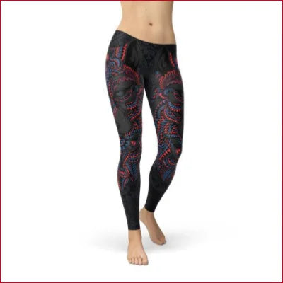 Patterned black women’s leggings with red swirls in a USA fabric blend for comfort